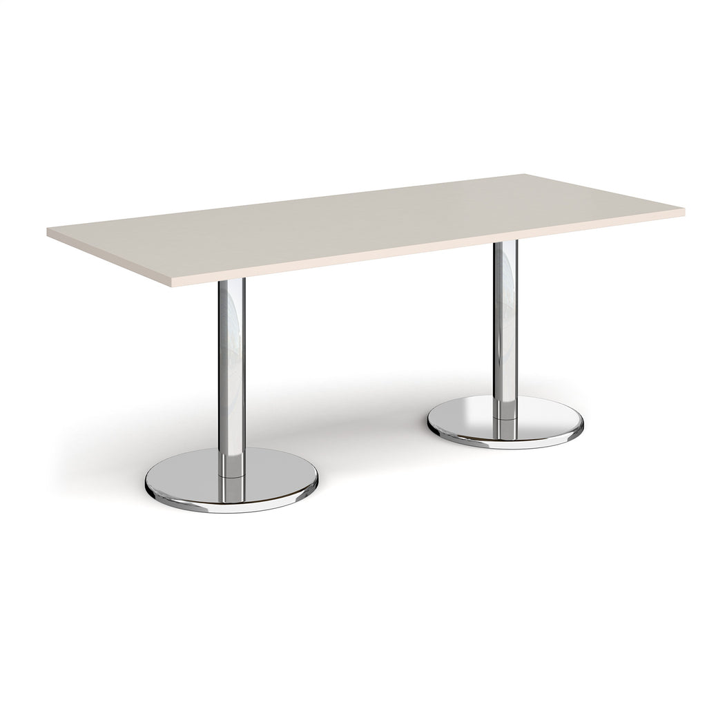 Rectangular table with light grey top and chrome legs on a white background