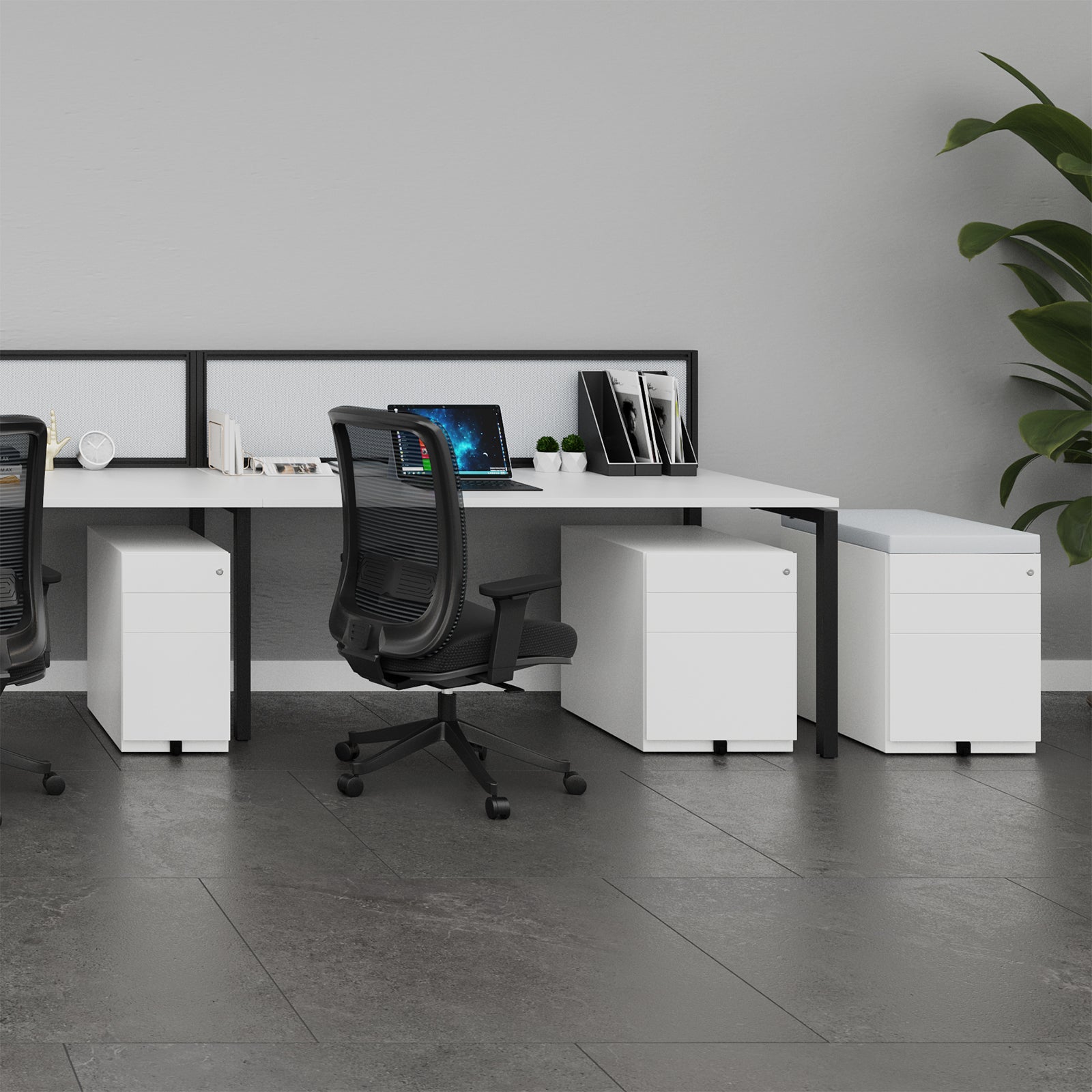 Modern office desk setup with chairs and a computer in a minimalistic office setting.