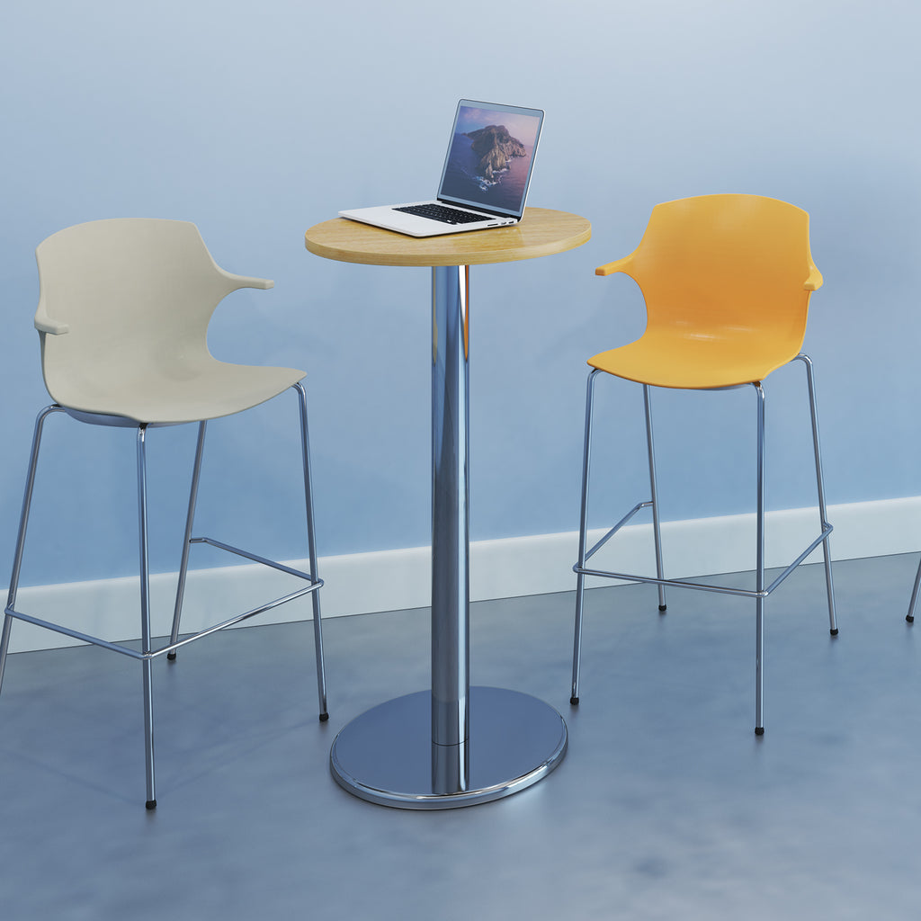 Two bar stools and a small round poseur table with a laptop on a blue floor and wall.