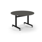 Round table with grey top and metal legs with wheels on a white background