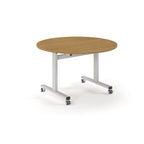 Round table with wood-effect top and  metal legs with wheels on a white background