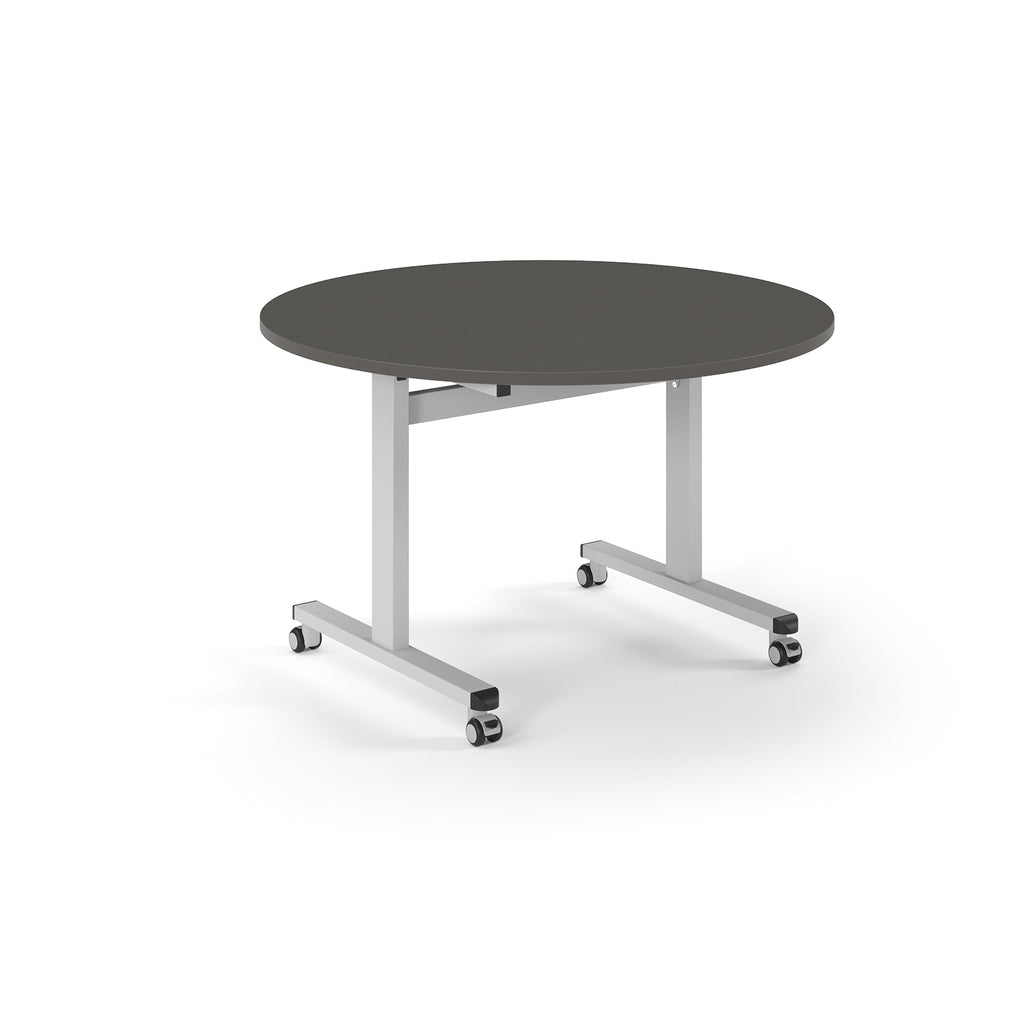 Round table with grey top and  metal legs with wheels on a white background