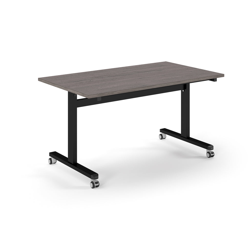 Rectangular table with grey wood-effect top and metal legs with wheels on a white background