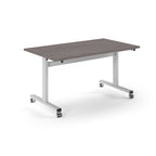 Rectangular table with grey wood-effect top and metal legs with wheels on a white background