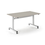 Rectangular table with light grey top and metal legs with wheels on a white background