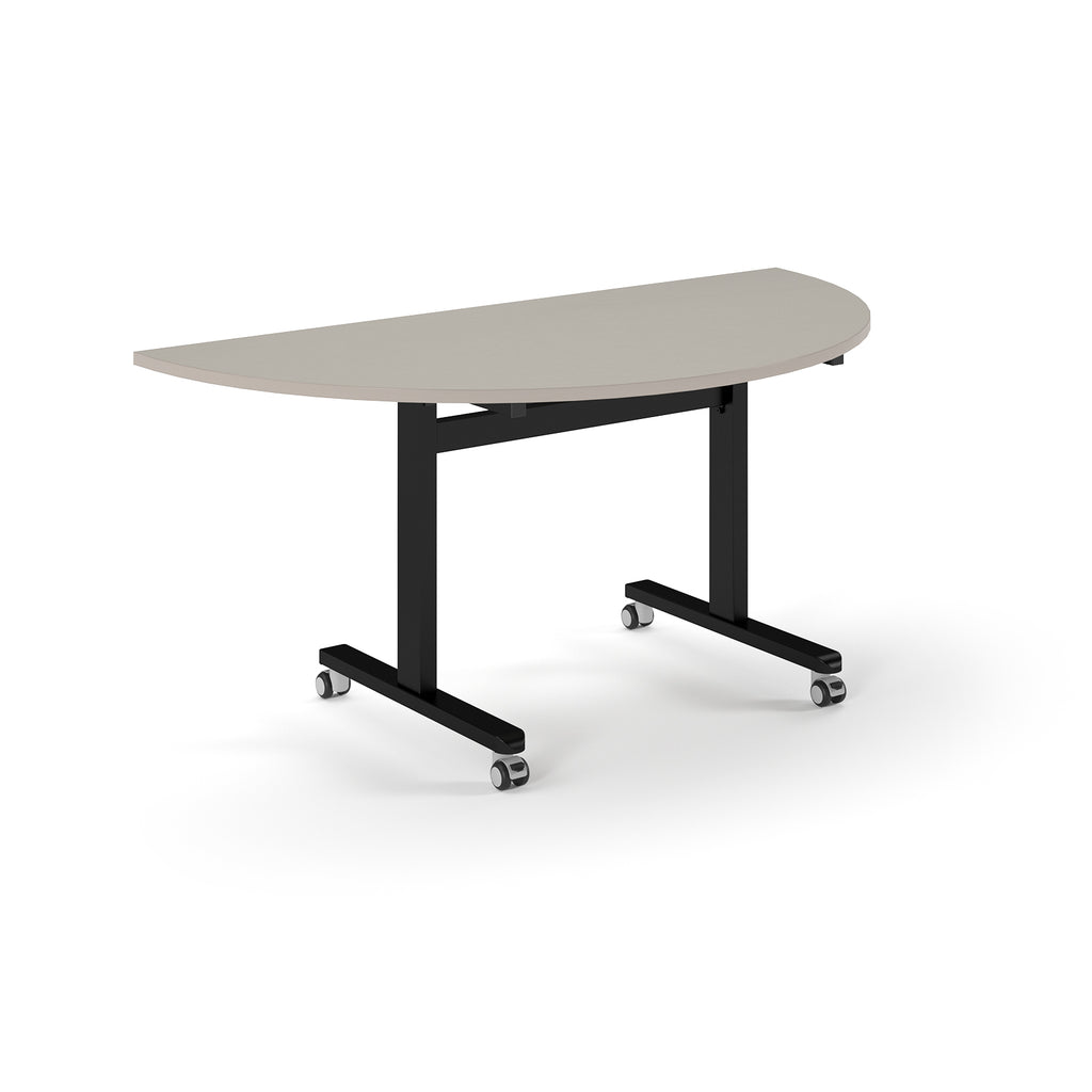 Semi-circular table with light grey top and metal legs with wheels on a white background