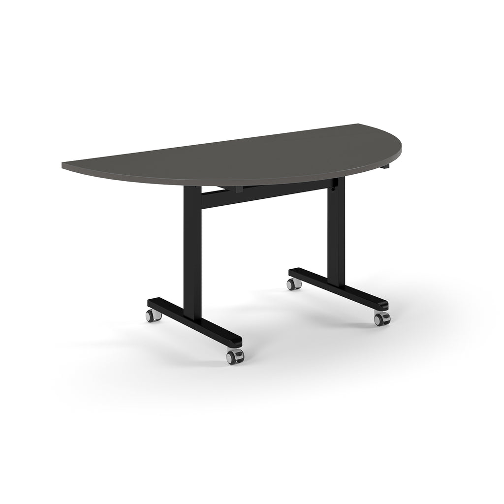 Semi-circular table with grey top and metal legs with wheels on a white background