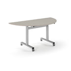 Semi-circular table with light grey top and metal legs with wheels on a white background