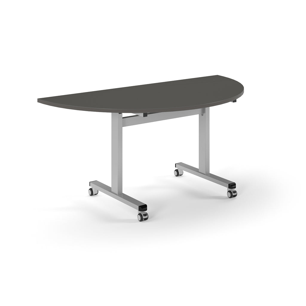 Semi-circular table with grey top and metal legs with wheels on a white background