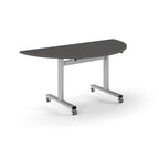 Semi-circular table with grey top and metal legs with wheels on a white background