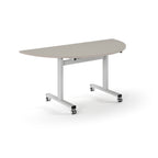 Semi-circular table with light grey top and metal legs with wheels on a white background