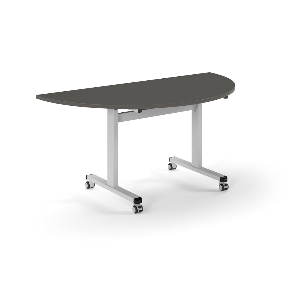 Semi-circular table with grey top and metal legs with wheels on a white background