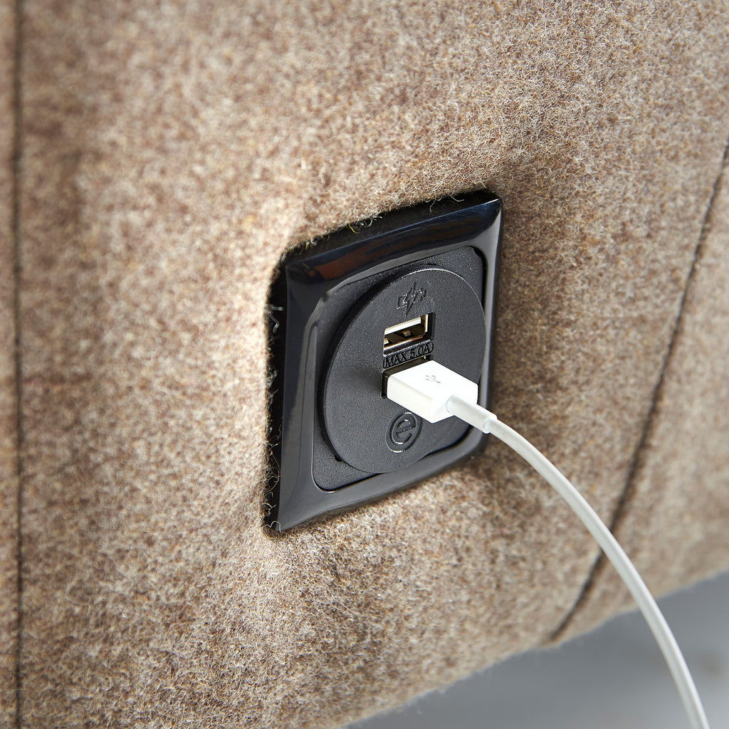 Power unit with cable on a soft seating background