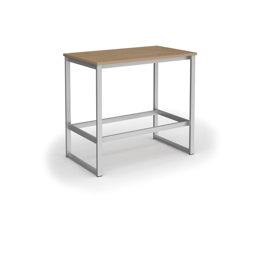 Rectangular high table with a wood-effect top, silver metal frame, and integrated lower support rail, shown on a white background.