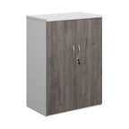 Lockable office cupboard with grey wood-effect doors and silver handles, shown on a white background.