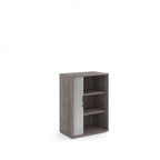 Wooden bookshelf with three shelves on a white background