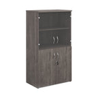Office storage cupboard with a grey wood-effect carcass, lockable lower doors, and upper glass display doors with internal shelving, shown on a white background.