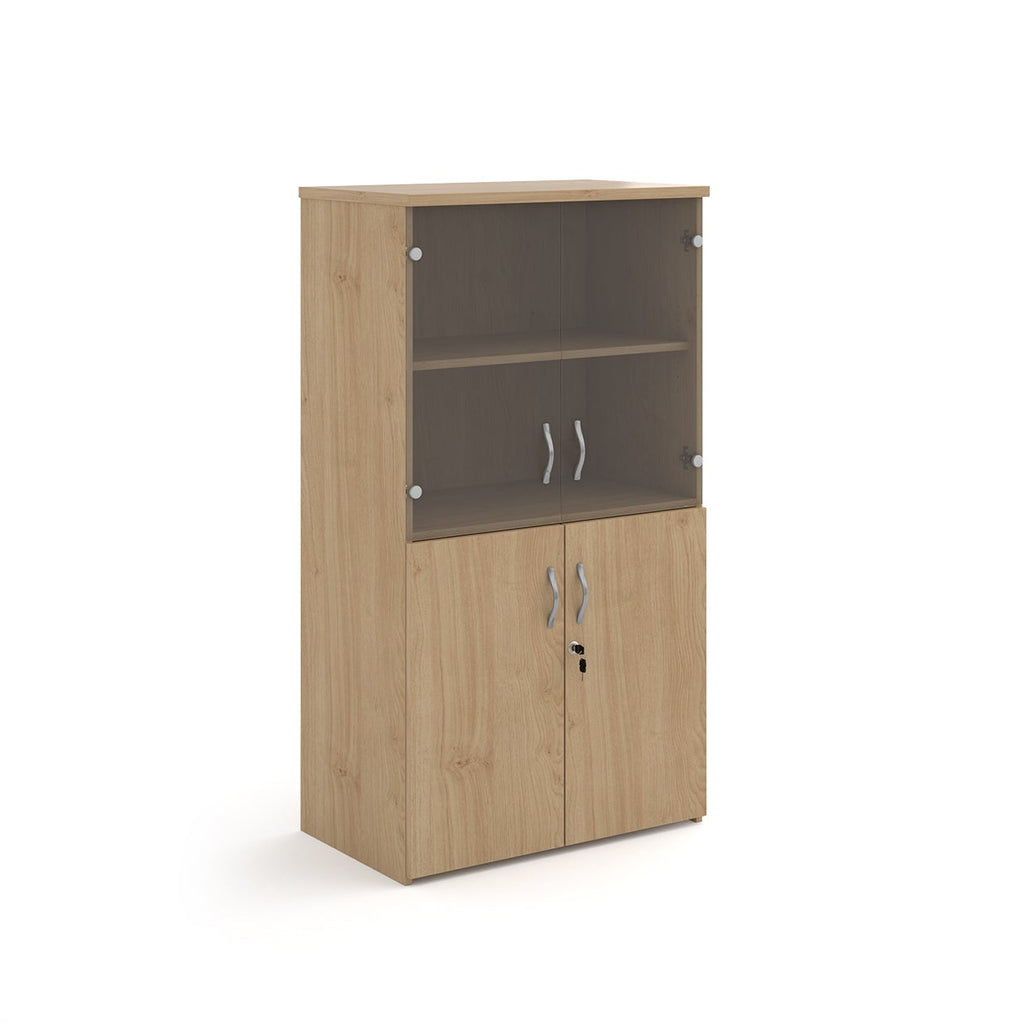 Office storage cupboard with a wood-effect carcass, lockable lower doors, and upper glass display doors with internal shelving, shown on a white background.