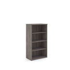 Wooden bookshelf with three shelves on a white background