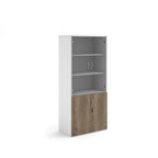 Tall office storage cupboard with a white carcass, lockable lower wood-effect doors, and upper glass display doors with internal shelving, shown on a white background.