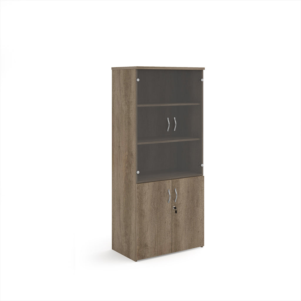 Tall office storage cupboard with a grey wood-effect carcass, lockable lower doors, and upper glass display doors with internal shelving, shown on a white background.