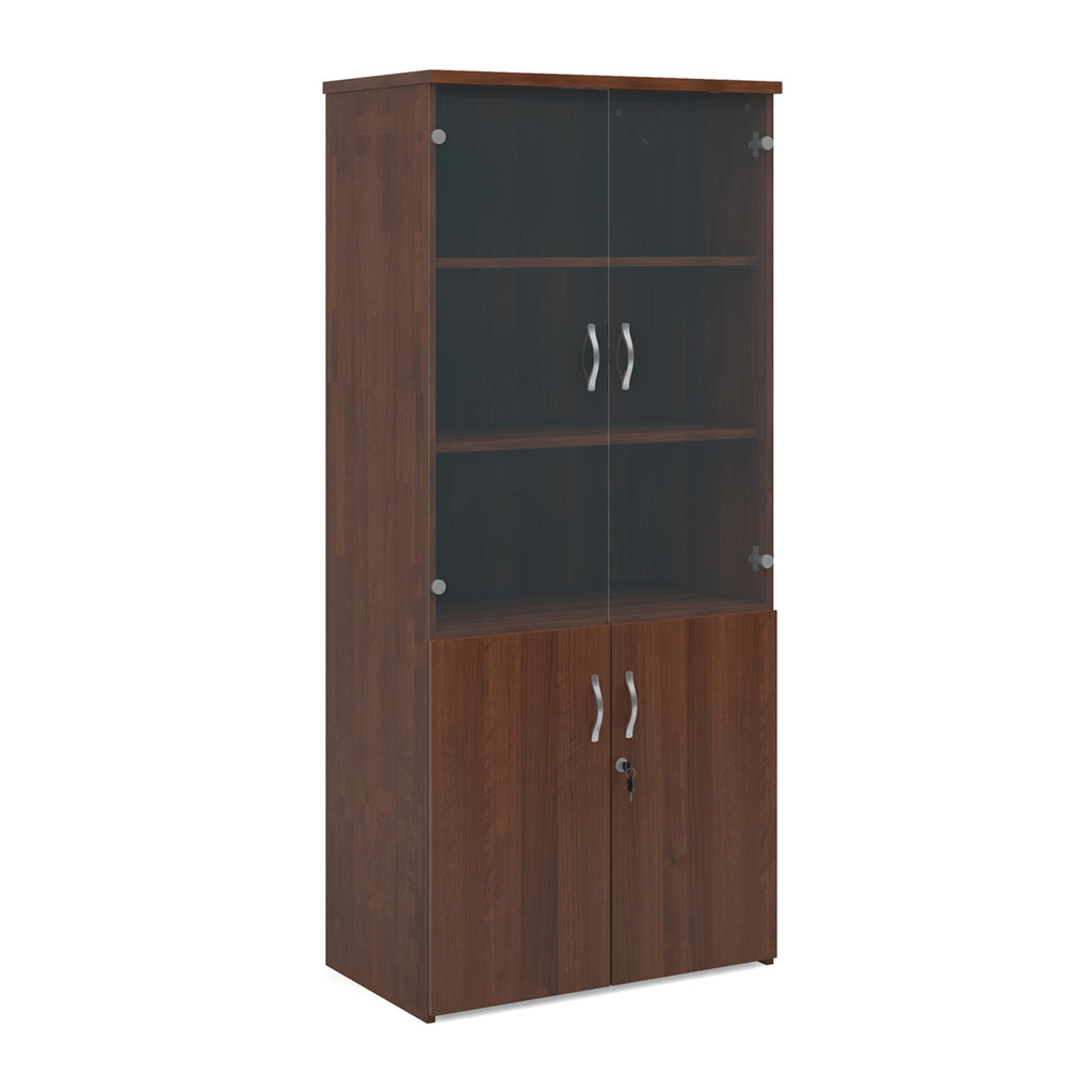 Tall office storage cupboard with a dark wood-effect carcass, lockable lower doors, and upper glass display doors with internal shelving, shown on a white background.