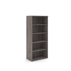 Wooden bookshelf with four shelves on a white background