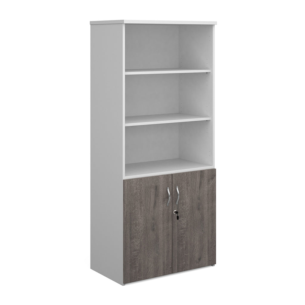 Tall office storage cupboard with a white carcass, open upper shelving, and lockable lower grey wood-effect doors, shown on a white background.