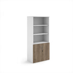 Tall office storage cupboard with a white carcass, open upper shelving, and lockable lower wood-effect doors, shown on a white background.