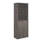 Tall office storage cupboard with a grey wood-effect carcass, lockable lower doors, and upper glass display doors with internal shelving, shown on a white background.