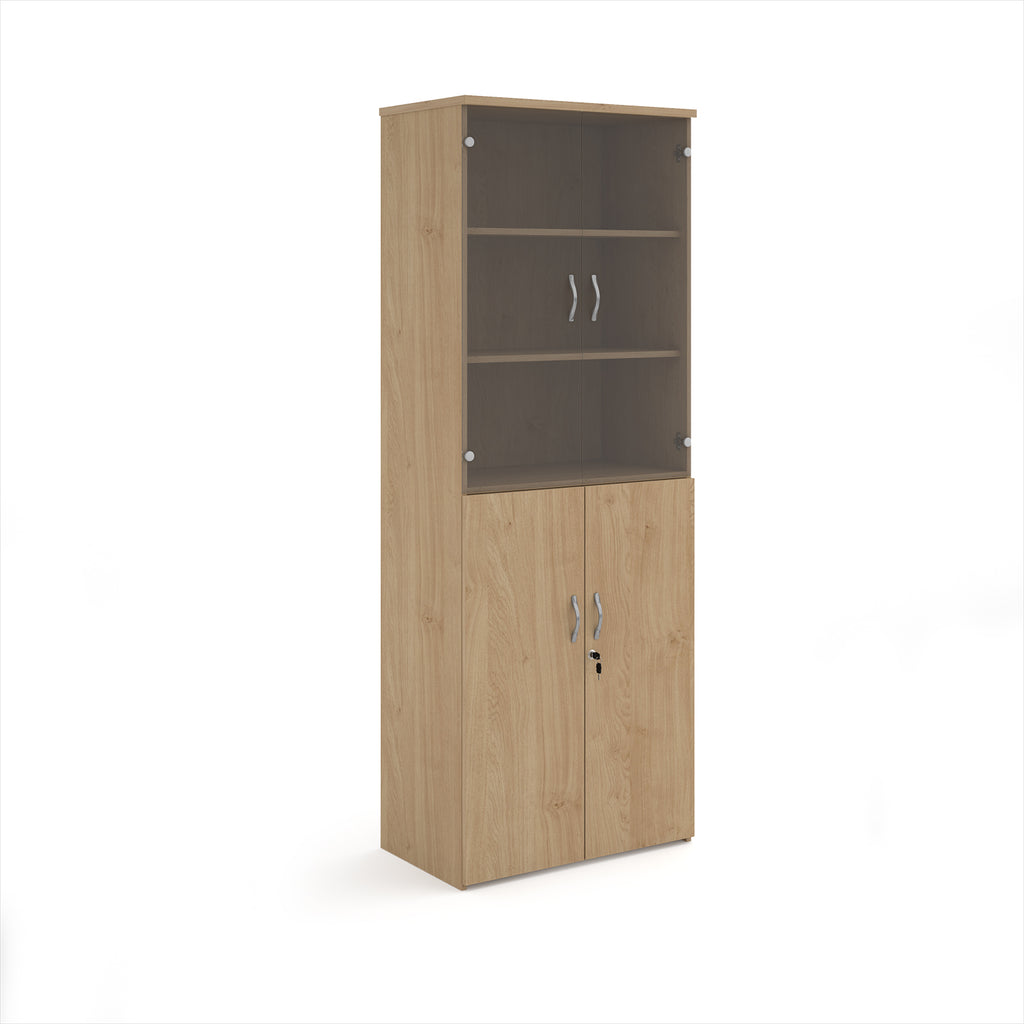 Tall office storage cupboard with a wood-effect carcass, lockable lower doors, and upper glass display doors with internal shelving, shown on a white background.