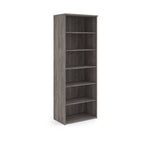 Wooden bookshelf with five shelves on a white background