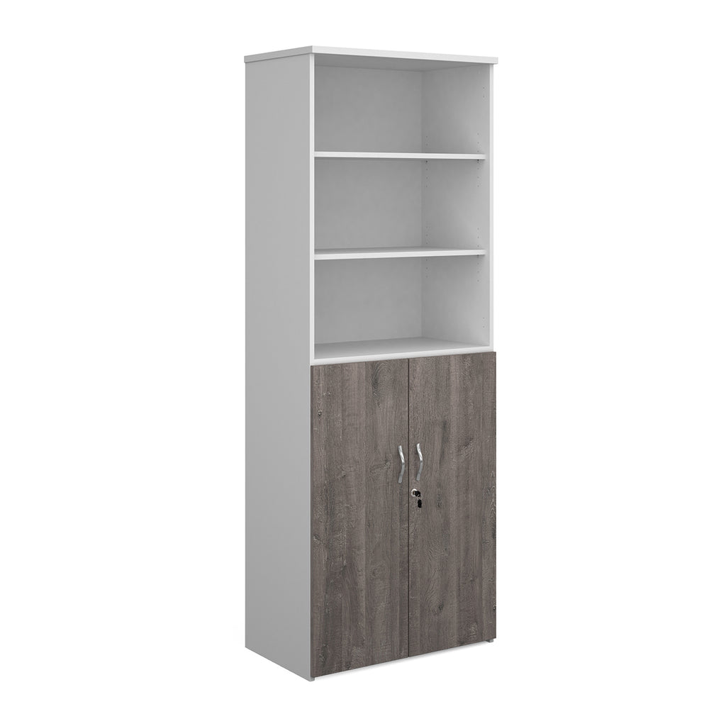 Tall office storage cupboard with a white carcass, open upper shelving, and lockable lower grey wood-effect doors, shown on a white background.