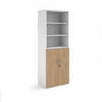 Tall office storage cupboard with a white carcass, open upper shelving, and lockable lower wood-effect doors, shown on a white background.