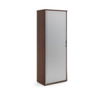 Tall wooden cabinet with a glass door on a white background