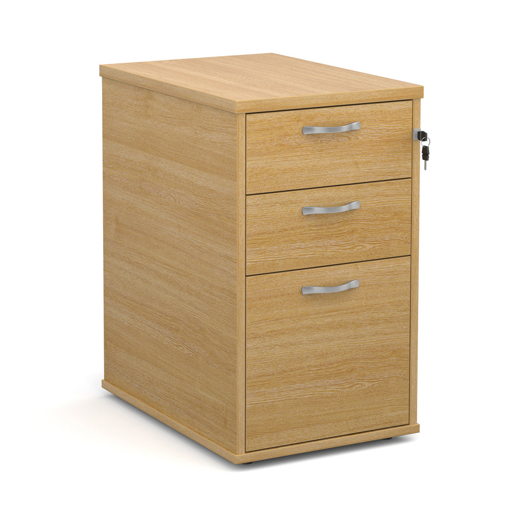 Wooden file cabinet with three drawers on a white background