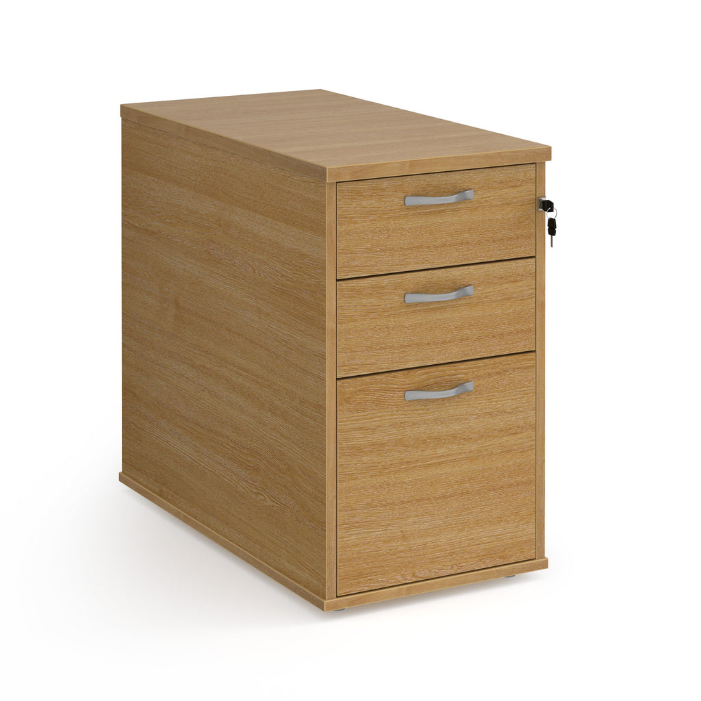 Wooden file cabinet with three drawers on a white background