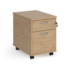 Wooden file cabinet with two drawers on wheels against a white background