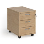 Wooden filing cabinet with three drawers on wheels against a white background