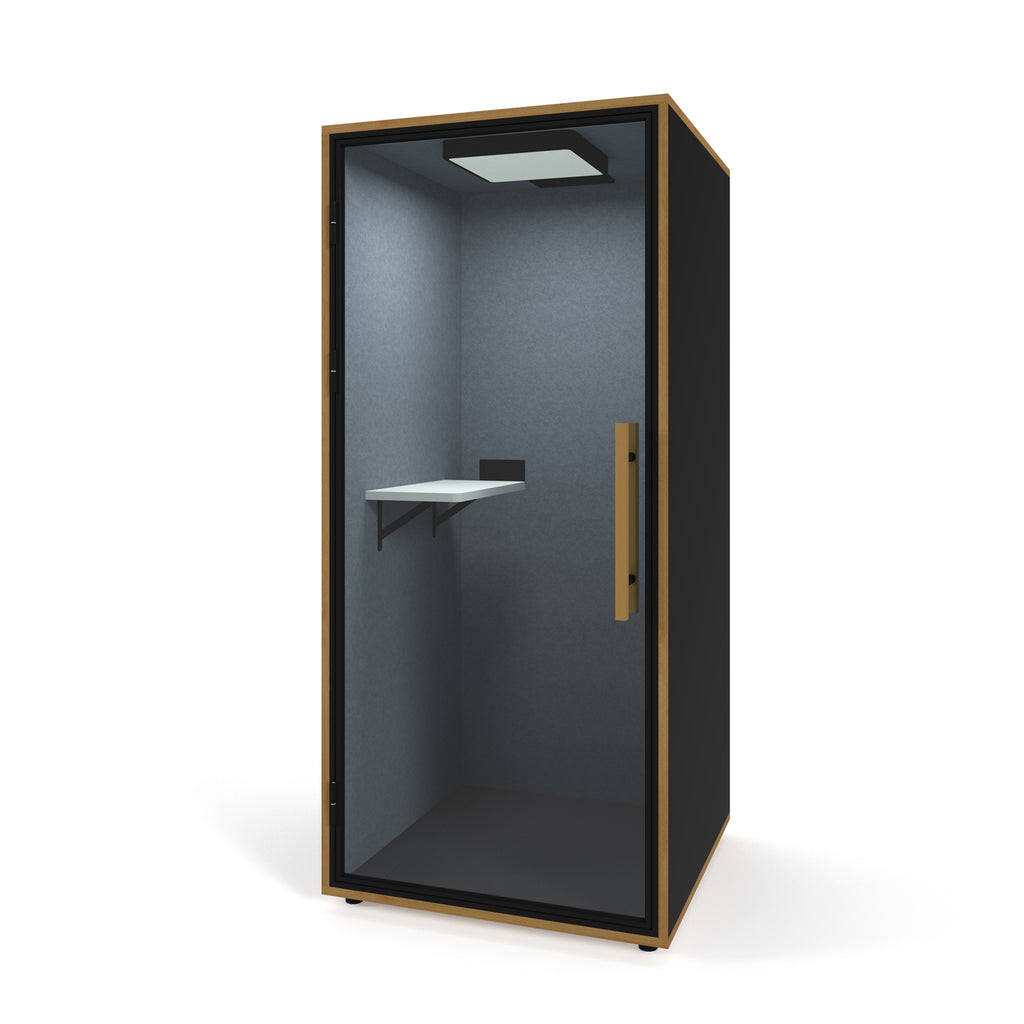 Black single acoustic booth with a table on a white background