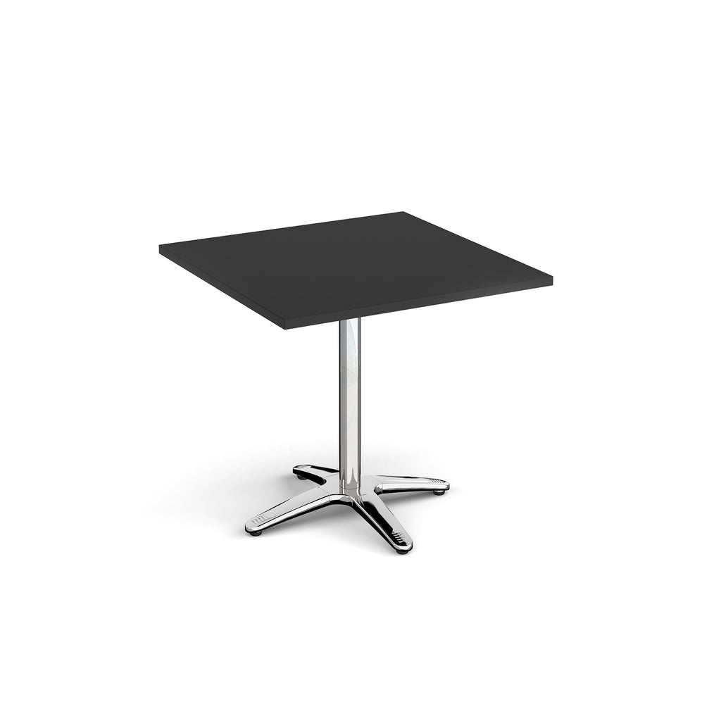 Square table with black top and chrome base on a white background