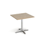 Square table with a wood-effect top and chrome base on a white background