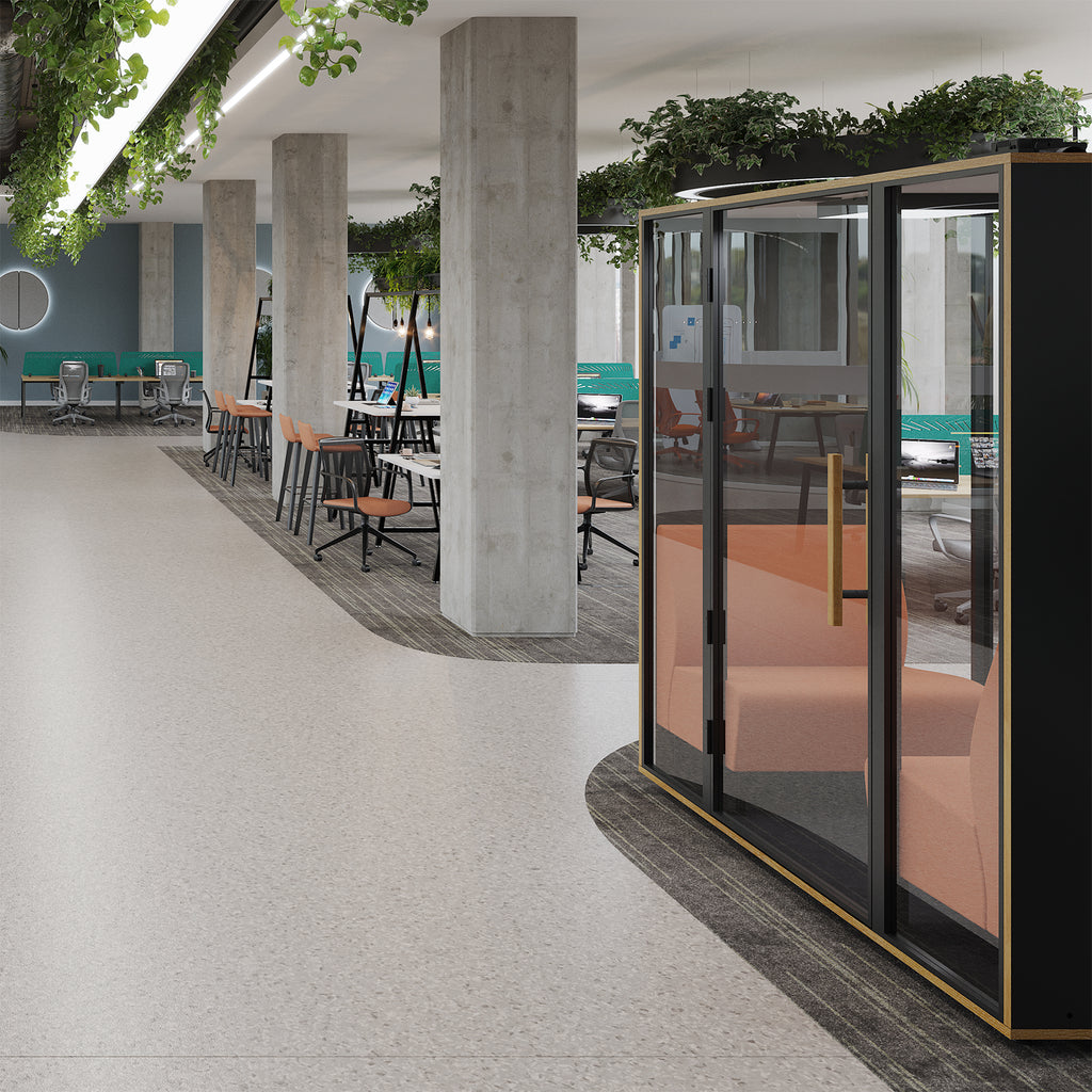 Modern outdoor seating area with a acoustic booth and concrete pillars.