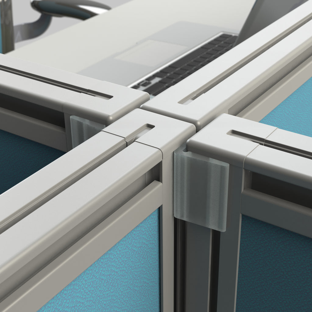 Close-up of office cubicle partitions with blue walls and gray frames.