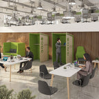 Modern collaborative office space with acoustic phone booths, shared tables, and seating areas, designed for focused work and informal meetings.