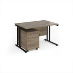 Wooden desk with black metal legs on a white background