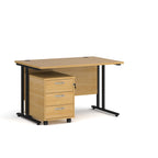Wooden desk with black legs and a matching pedestal on a white background
