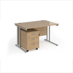 Wooden office desk with three drawers on a white background