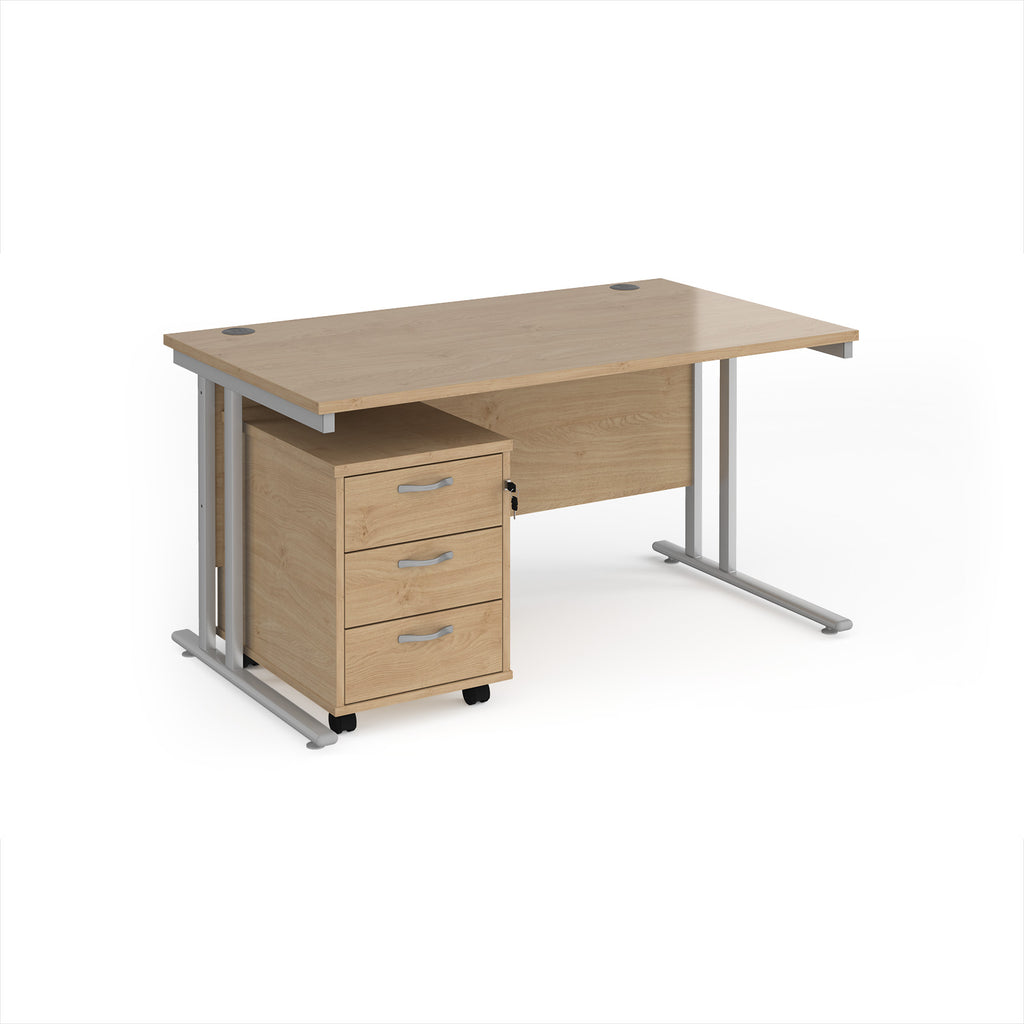 Wooden office desk with metal legs and pedestal on a white background
