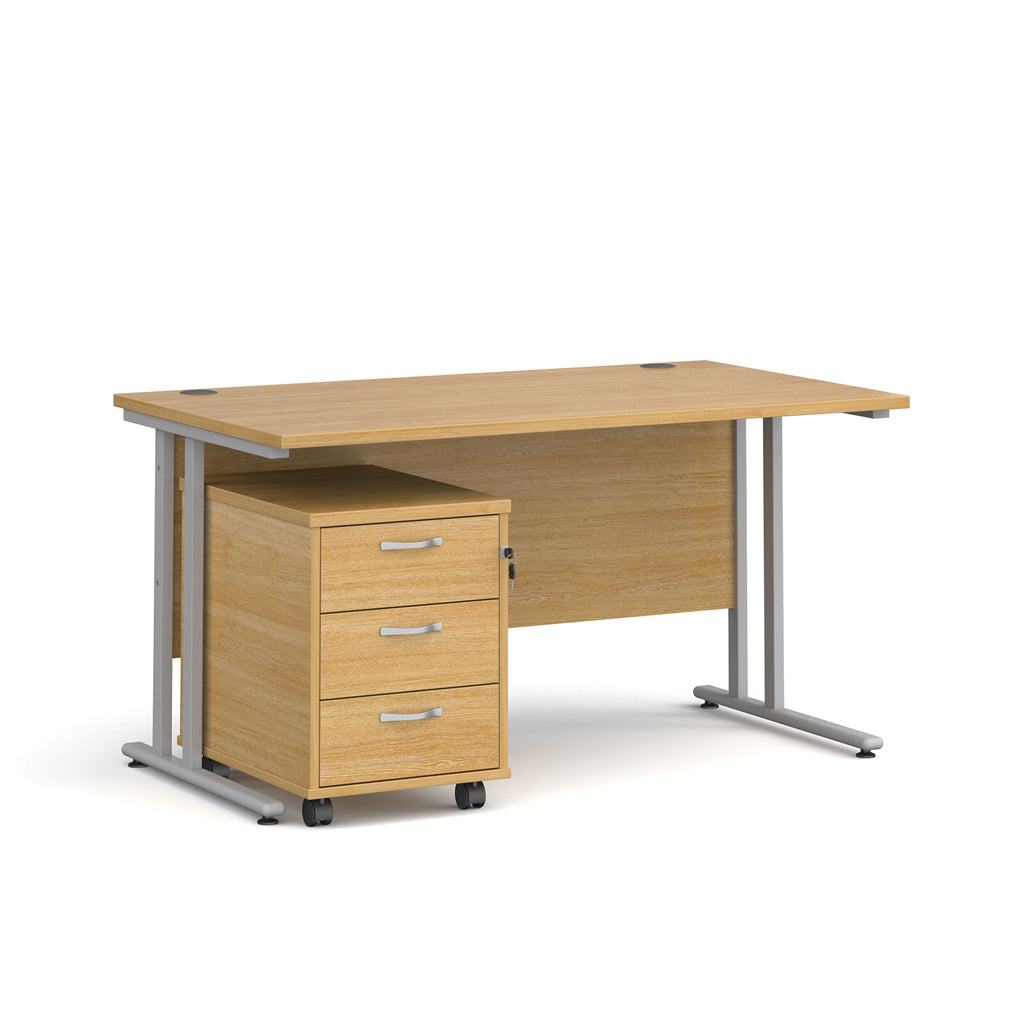 Wooden office desk with a metal frame and a matching pedestal on a white background